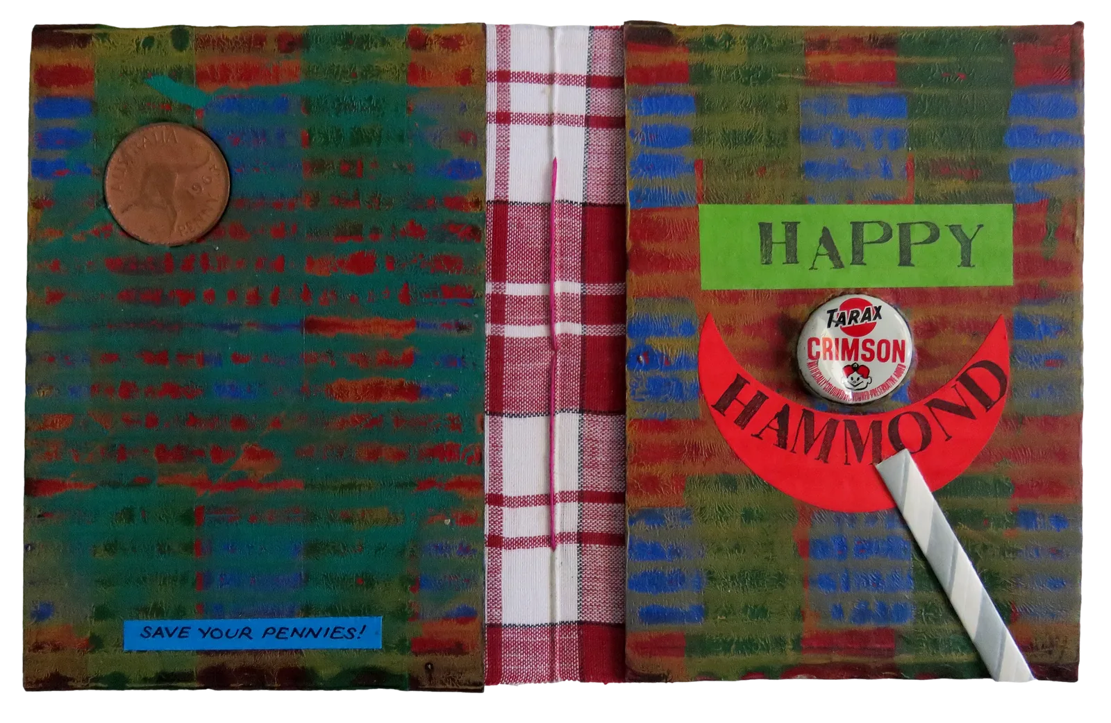 A small hand-bound book opened flat: a painted green and red cover with a 1963 penny set into it and a label Save your pennies; a red and white check cloth spine; the front cover lettered Happy over a red crescent lettered Hammond, with a Tarax Crimson bottle top set into it as a head.